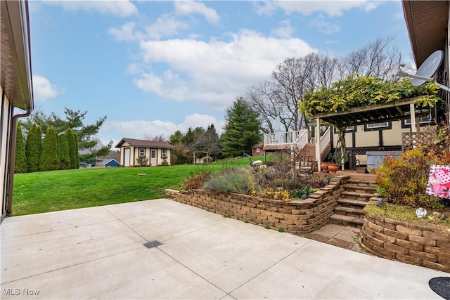 view of patio with an outbuilding