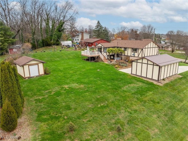 view of yard featuring a shed and a deck