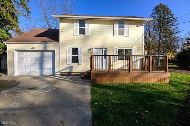 view of front of house with a front yard and a garage