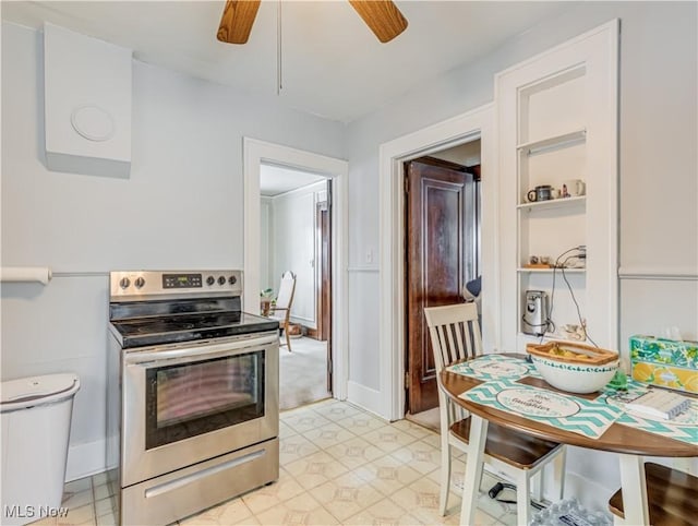 kitchen featuring electric range and ceiling fan