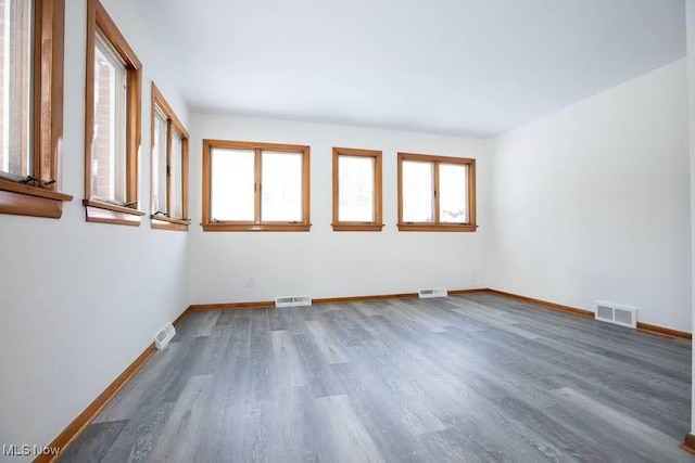 spare room featuring hardwood / wood-style floors