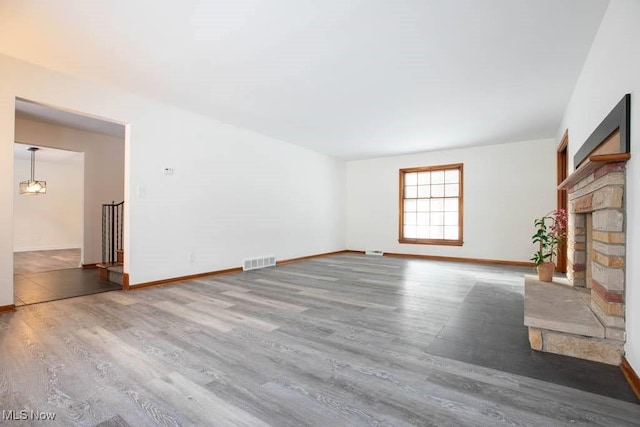 unfurnished living room featuring hardwood / wood-style floors