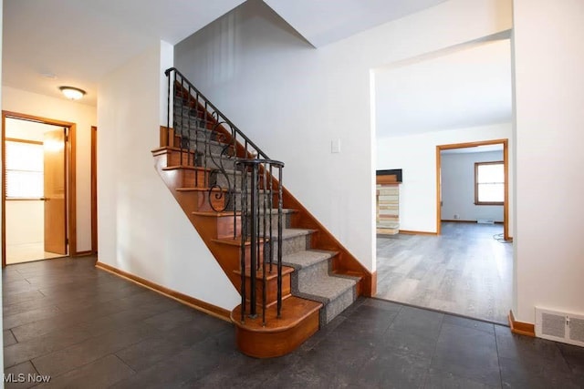 stairs featuring hardwood / wood-style flooring