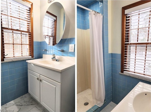 bathroom featuring vanity, walk in shower, and tile walls