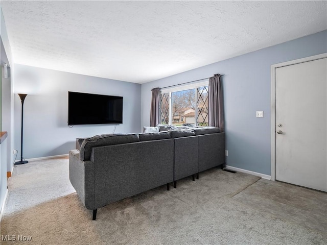 carpeted living room with a textured ceiling