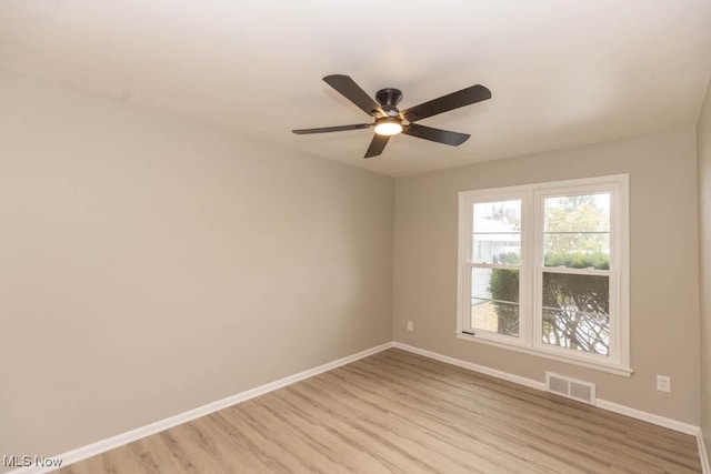 unfurnished room with ceiling fan and light hardwood / wood-style floors