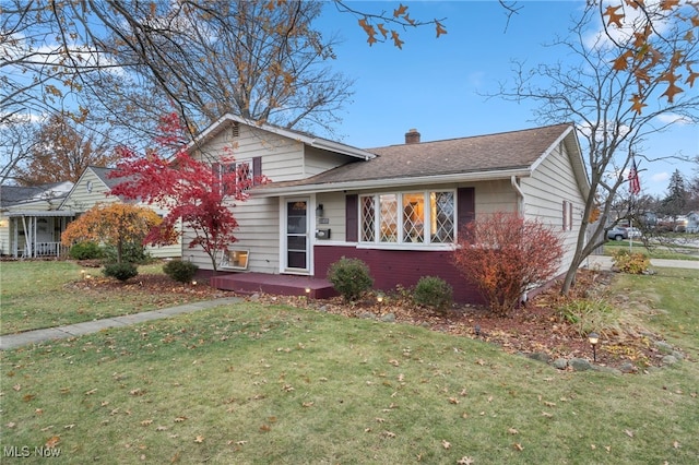 split level home with a front yard