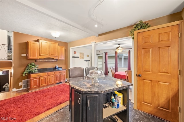 kitchen with a center island and ceiling fan