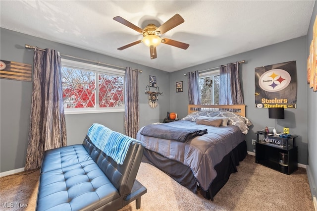 bedroom with ceiling fan and carpet