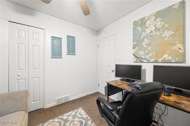 carpeted home office with ceiling fan