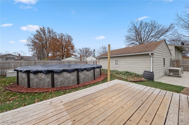 wooden deck with a covered pool