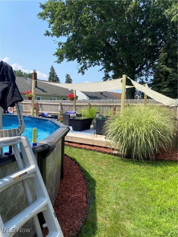 view of yard featuring a swimming pool side deck