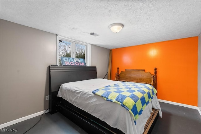 bedroom featuring a textured ceiling