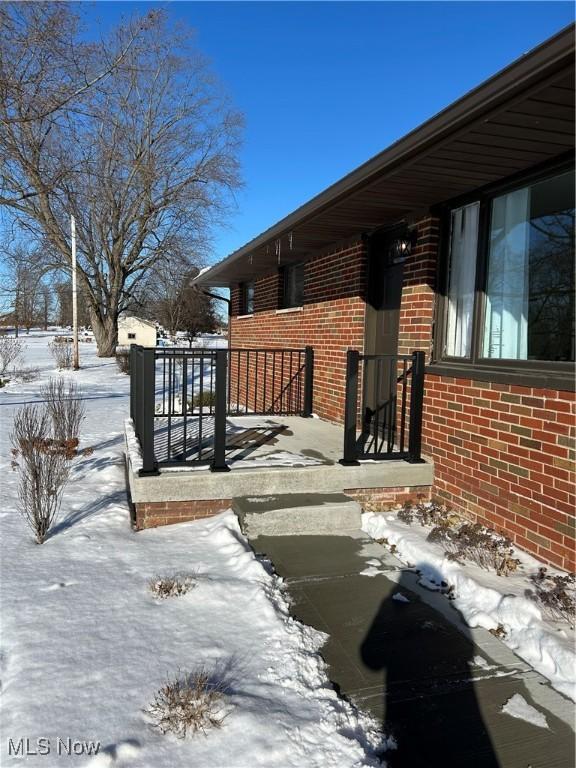 view of snow covered property