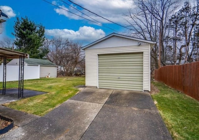 garage featuring a lawn