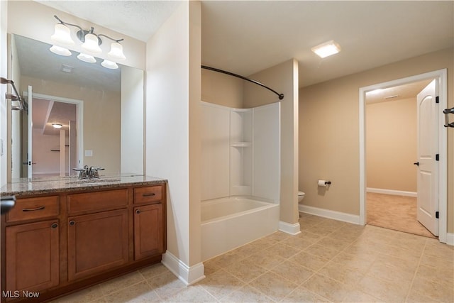 full bathroom with shower / tub combination, vanity, and toilet