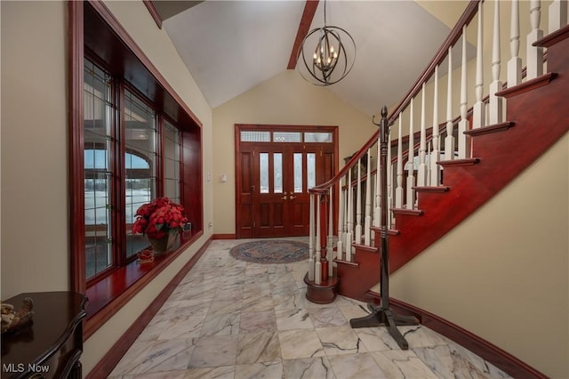 entrance foyer featuring vaulted ceiling and an inviting chandelier