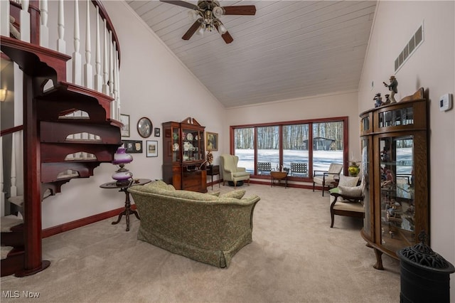 living room with ceiling fan, light colored carpet, and high vaulted ceiling