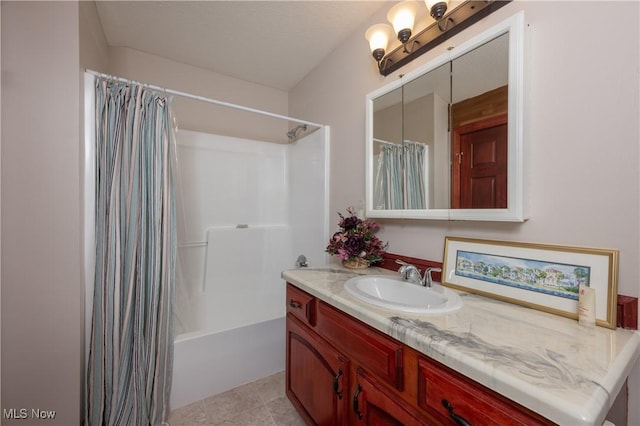 bathroom with vanity and shower / bath combo