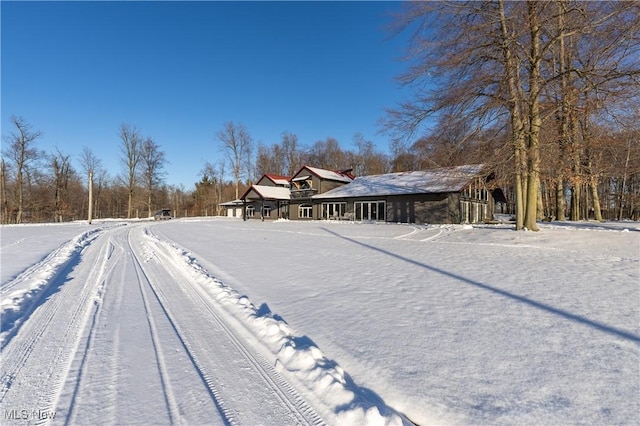 view of yard layered in snow