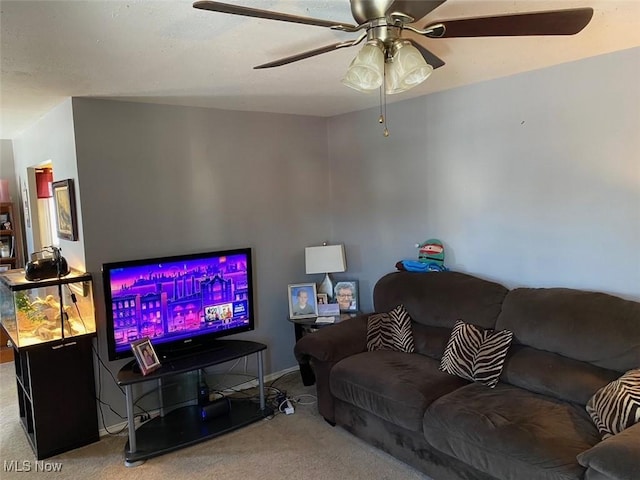 living room featuring ceiling fan and light carpet