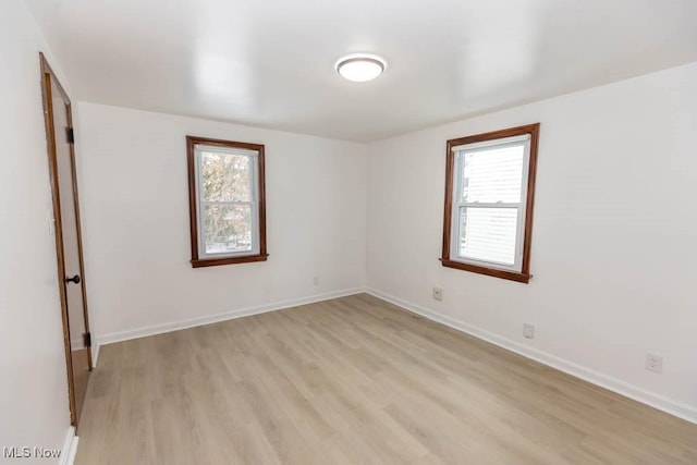 spare room featuring light hardwood / wood-style floors