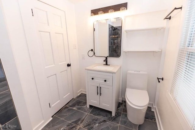 bathroom with vanity and toilet