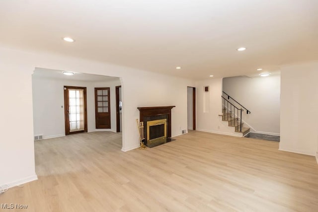 unfurnished living room featuring light wood-type flooring