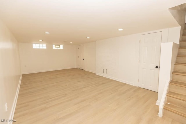 basement featuring light wood-type flooring