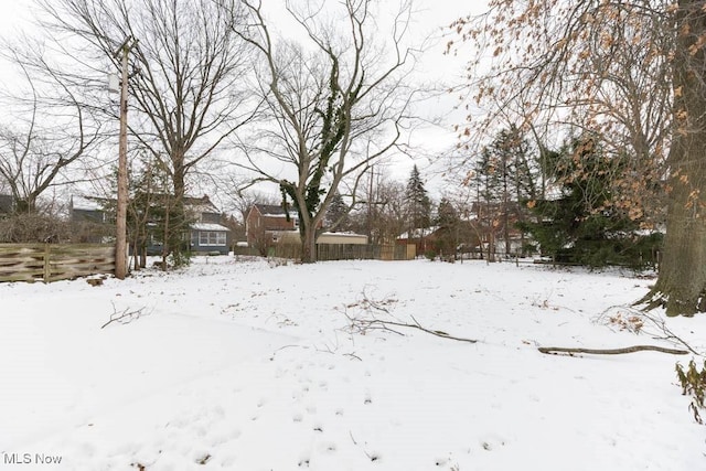 view of yard layered in snow