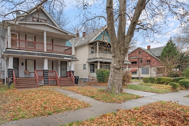 view of front of property with a balcony and covered porch