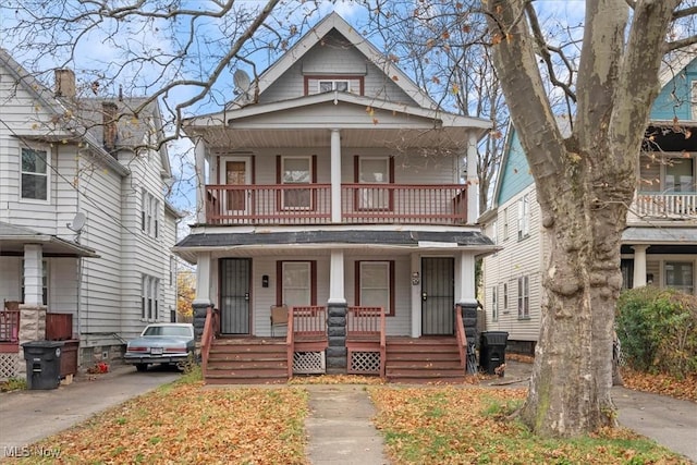 view of front of home featuring a balcony and covered porch