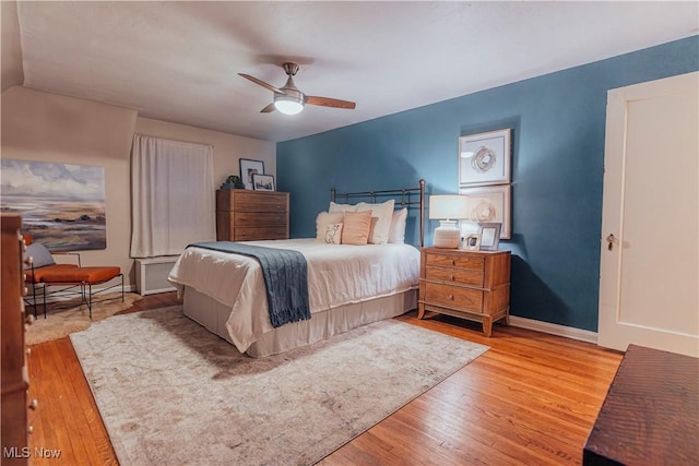 bedroom featuring ceiling fan and light hardwood / wood-style floors