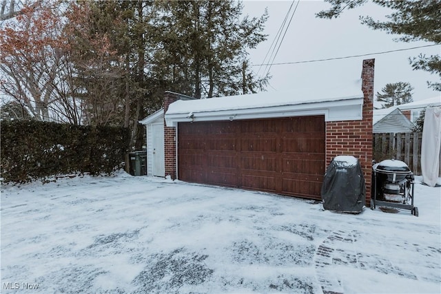 view of snow covered garage