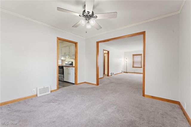 unfurnished room featuring crown molding, carpet floors, and ceiling fan