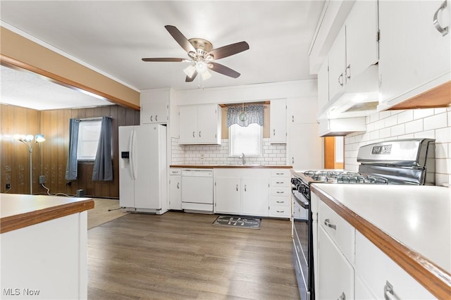 kitchen featuring custom range hood, white appliances, ceiling fan, sink, and white cabinetry