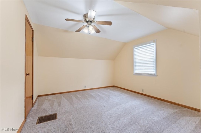 bonus room featuring ceiling fan, light colored carpet, and vaulted ceiling