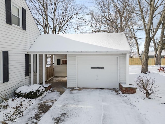 view of snow covered garage