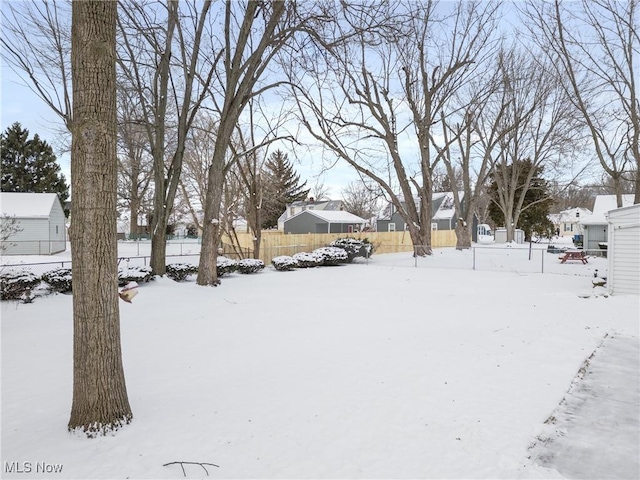 view of yard layered in snow