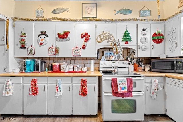 kitchen with white cabinetry, wood-type flooring, white electric range, and tasteful backsplash