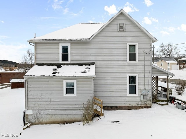 view of snow covered property