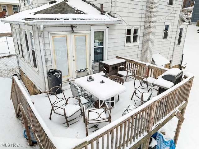 view of snow covered deck