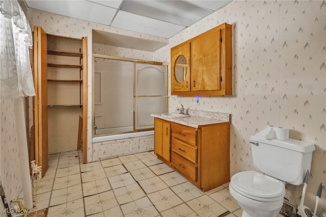 full bathroom featuring shower / bath combination with glass door, vanity, and toilet