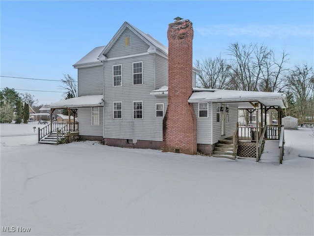 view of snow covered house