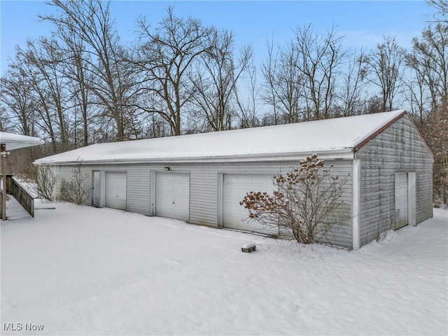 view of snow covered garage