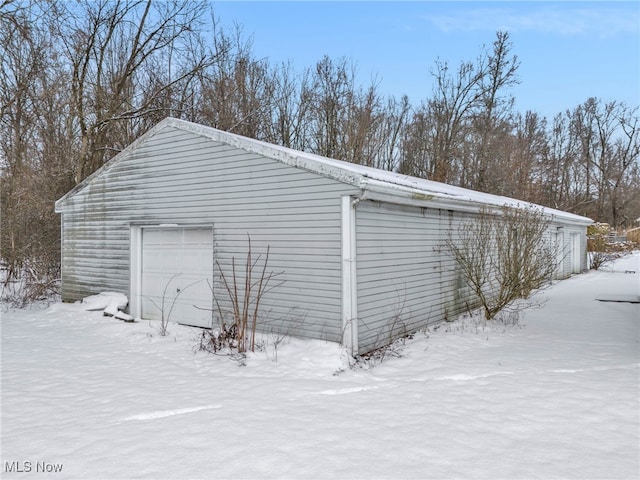 view of snow covered garage