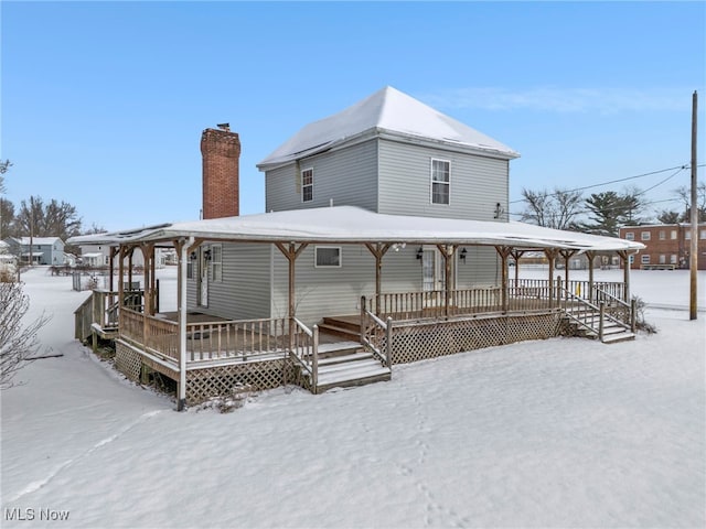 view of snow covered house