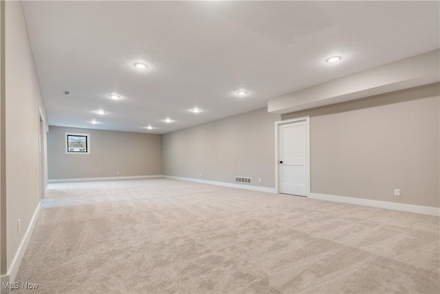 basement with light colored carpet