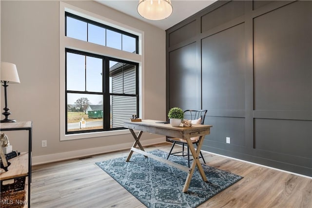 office space with light hardwood / wood-style flooring