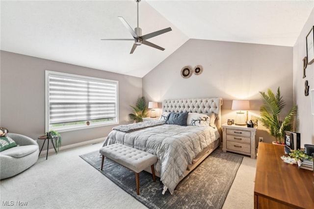 carpeted bedroom with ceiling fan and lofted ceiling